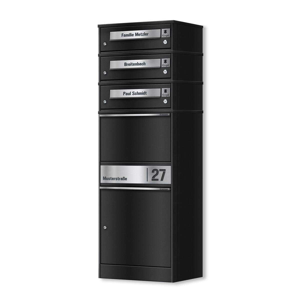 Tall black metal mail locker with four labeled small drawers and a wide bottom compartment