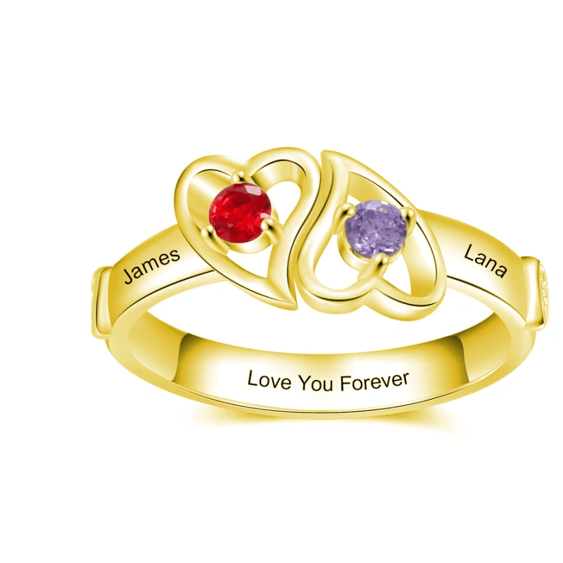 Gold stackable rings with heart-shaped settings and red and purple gemstones, engraved with James and Lana and 'Love You Forever'.
